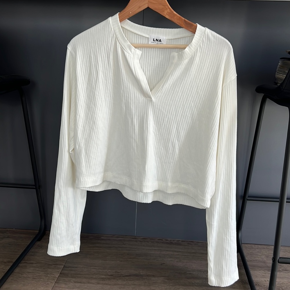 LNA cropped white long sleeve top.